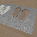 White and Brown Slippers Placed on Gray Mat Over Wooden Floor