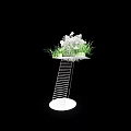 Banquet Hall Decor With White Metal Stand Circular Tray White Flowers And Green Grass