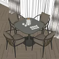 Dining Table Set with Four Woven Backrest Chairs Gray Tabletop Teapot Glasses and Napkin