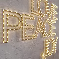 Decorative Letter Lights With BELIEVE LOVE PEACE JOY Words On Wall Warm Yellow Glow