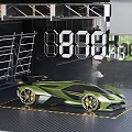 Green Sports Car Displayed With 888 Numbers Scaffolding And Lighting Equipment On Yellow Lines Floor