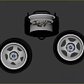 Car Tires Stacked With Metallic Wheel Rim On Dark Reflective Surface