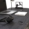 Modern Black Desk With Laptop Headphones Desk Lamp And Brown Chair
