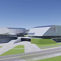 Modern Geometric Architecture Complex With Blue Roofs Sports Field And Surrounding Green Areas