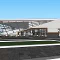 Modern Architectural Building With Geometric Glass Roof Large Windows Lawn And Stone Paved Ground