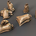 Brown Burlap Sandbags With Knotted Tops In Stacked And Loose Arrangement