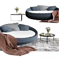 Round Navy Blue Sectional Sofa with Gray Throw Pillows Brown Blanket and Side Table 3d model