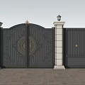 Elegant Black Entrance Gate With Ornate Carvings Stone Pillars And Lush Green Trees