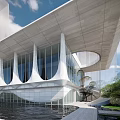 Modern Architectural Design With White Curved Structures Glass Facade And Water Reflection