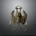Golden Bat Wing Candelabra With Ornate Design And Two Candles