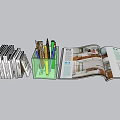 Stack of Books Green Pen Holder with Pens and Open Magazine Showing Interior Design