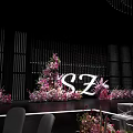 Wedding Banquet Stage With Pink Drapery White Tables Chairs And Flower Decorations