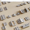 Various Metal Hinges of Different Sizes Laid on Wooden Surface