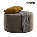 Gray Upholstered Round Ottoman Bench With Yellow Cushion And Gray Knit Blanket