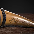 Natural Ox Horn Drinking Cup With Black Leather Straps On Wooden Floor