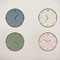 Four Decorative Wall Mounted Clocks in Different Colors for Home Decor
