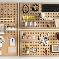 Wooden Pegboard Wall Decor With Headphones Keyboard Cups Photo Frames And Plants