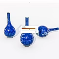 Three Blue Ceramic Vases With White Patterns Slender Neck Round Body One Lying On Side