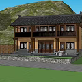 Traditional Chinese Two Story Building With Courtyard Stone Path And Green Trees