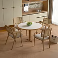 Minimalist Round Table With Woven Backrest Chairs For Home Dining Area 3d model