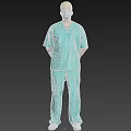 Man Standing in Teal Scrub Suit With Yellow Surgical Cap And Face Mask