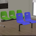 A Row of Green and Blue Public Chairs with Metal Legs in Indoor Waiting Area