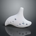 White Ceramic Ocarina Musical Instrument With Multiple Sound Holes And Shiny Reflective Surface