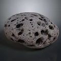 Natural Porous Stone with Many Holes on Textured Rounded Surface
