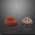 Two Different Bean Bag Chairs with Orange Velvety and Colorful Striped Designs