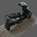 White And Black Electric Scooter With Black Seat Parked On Brick Pavement