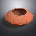 Reddish Brown Clay Pot With Carved Wavy Patterns And Protruding Decorations