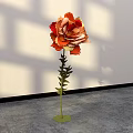 Large Paper Flower Floral Installation With Orange Yellow Petals Green Stem And Shadowy White Wall
