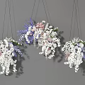 Colorful Hanging Flowers with White Pink Purple Blooms and Green Leaves against Gray Background