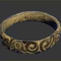 Golden Decorative Ring With Intricate Carved Patterns And Shiny Surface