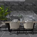 Modern Dining Table Set with Wicker Chairs Green Plants and Stone Wall 3d model