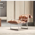 Modern Single Sofa With Brown Leather And Metal Frame In Contemporary Living Interior
