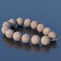 Textured Round Beaded Bracelet On Dark Reflective Surface With Shiny Finish 3d model