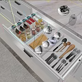 Well Organized Kitchen Drawer With Bowls Plates Utensils And Glass Jars