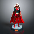 Female Superhero Statue With Green Blue Top Red Cape Boots Gold Details And Black Base