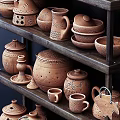 Handcrafted Ceramic Vessels in Various Styles on Wooden Shelves with Intricate Patterns