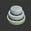 Three Tier White Cake with Blue Ribbons Yellow Heart Patterns and Drizzle Design
