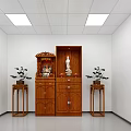 Religious Faith Worship Area Featuring Wooden Cabinet Buddha Statue And Potted Plants