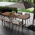 Outdoor wooden table and chairs set with white back large umbrella by lake view greenery