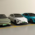 Green White Blue Electric Cars Parked In Modern Parking Lot With Clean Design