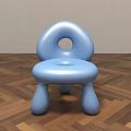Blue Rounded Children's Chair With Smooth Surface Hole In Backrest On Wooden Floor Light Wall