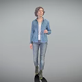 A Woman Standing in Blue Polka Dot Shirt White Undershirt Jeans Boots on Gray Background