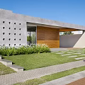 Modern Detached Villa Exterior Design With Gray Concrete Walls Wooden Door Lawn And Stone Path