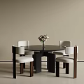 Round Black Table Four White Cushion Chairs Dark Brown Legs with Pink White Flower Vase