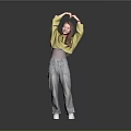 Woman Making Heart Gesture With Hands Above Head In Yellow Top And Gray Jeans