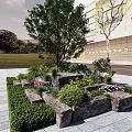 Garden Ornament With Stone Flower Beds Various Plants Tree Grass And Paved Ground